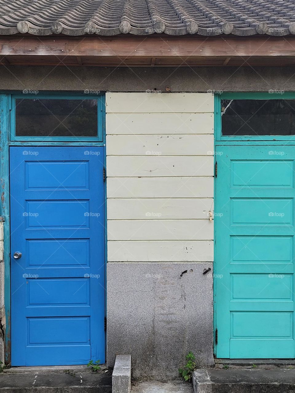 House with blue wooden door