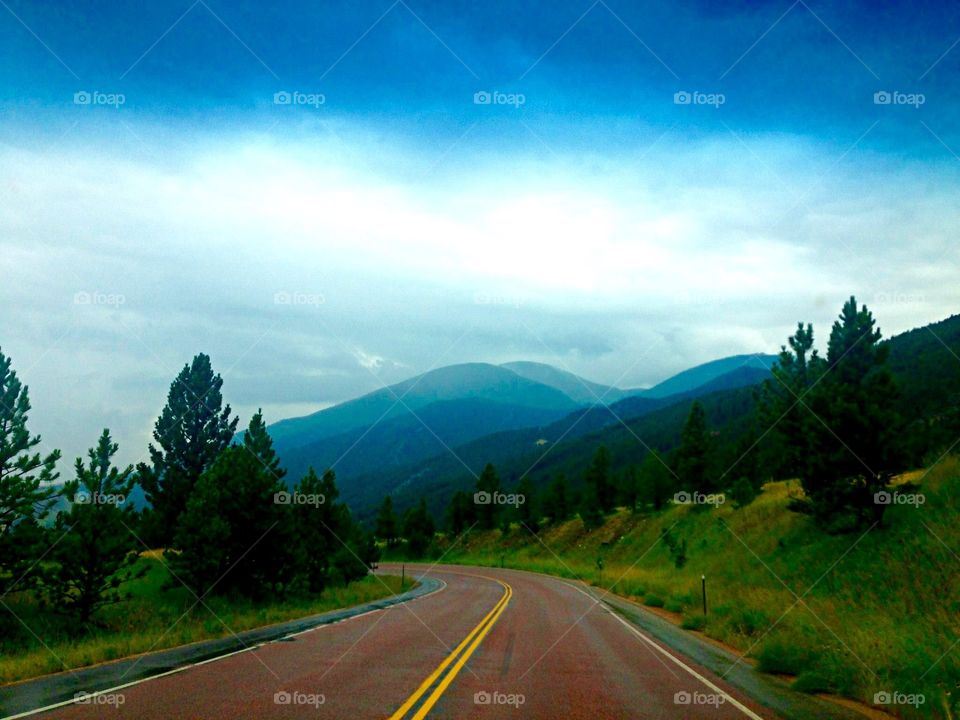 Take Me Home Country Roads. Winding country road through the mountains 