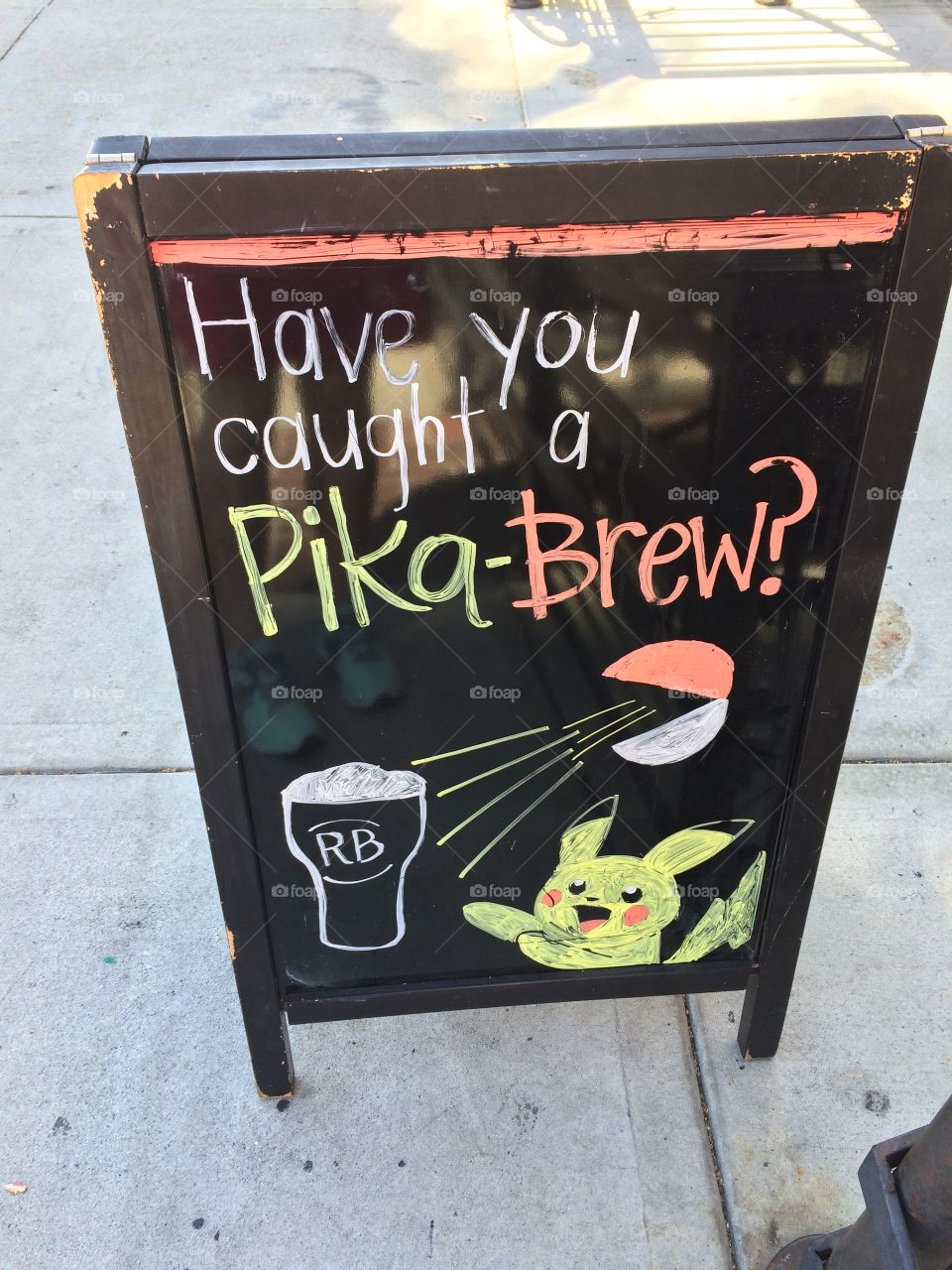 Business advertising on sidewalk with Pokemon