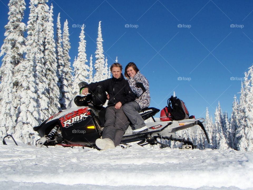 Couple on snowmobile 