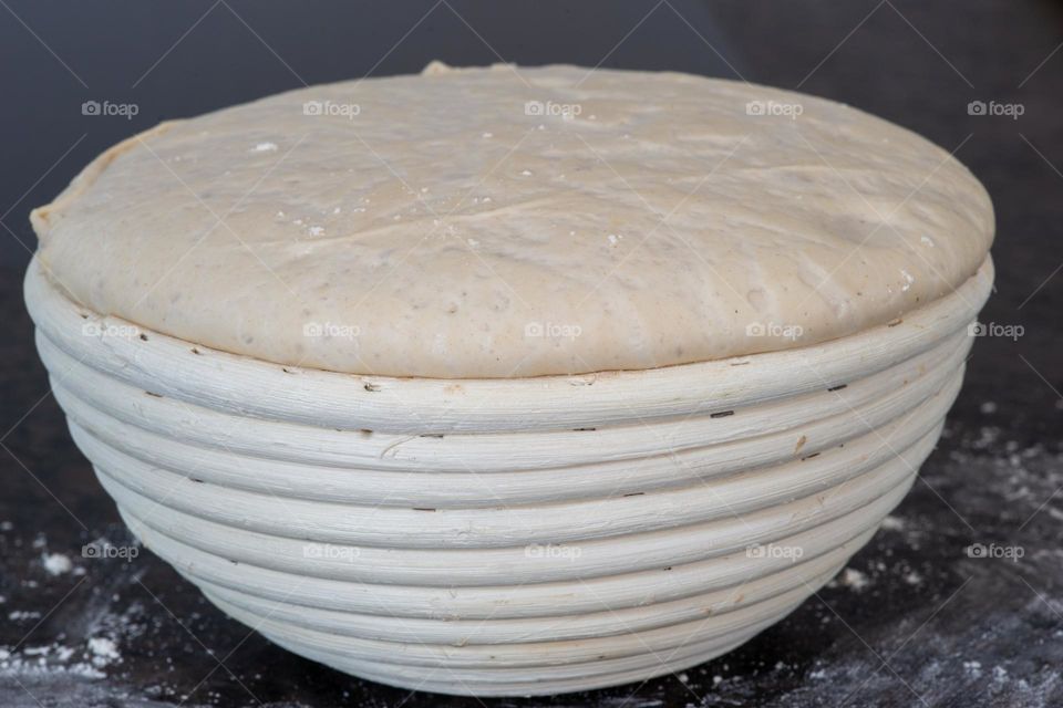 proofing basket with bread dough