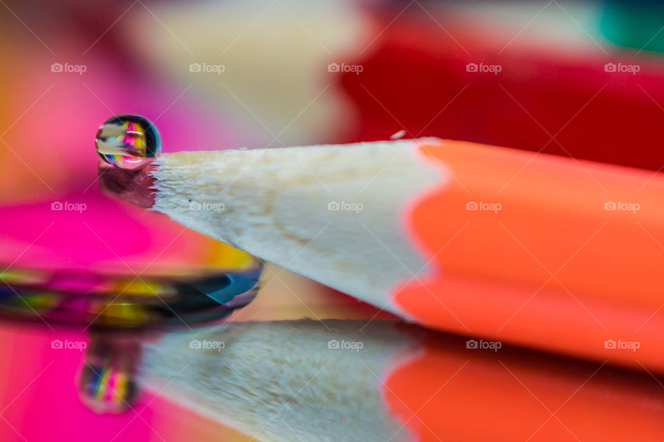 A drop on a colored pencil