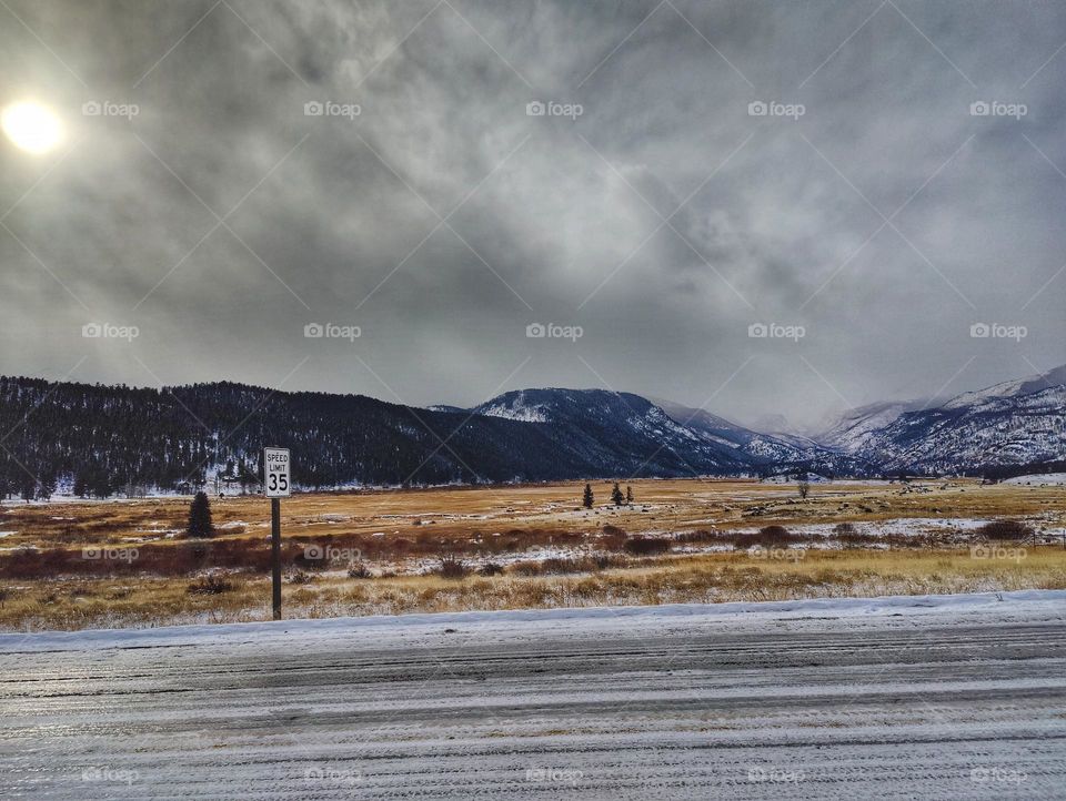 First snow in Estes National Park, icy roads, snow covered mountains and fields