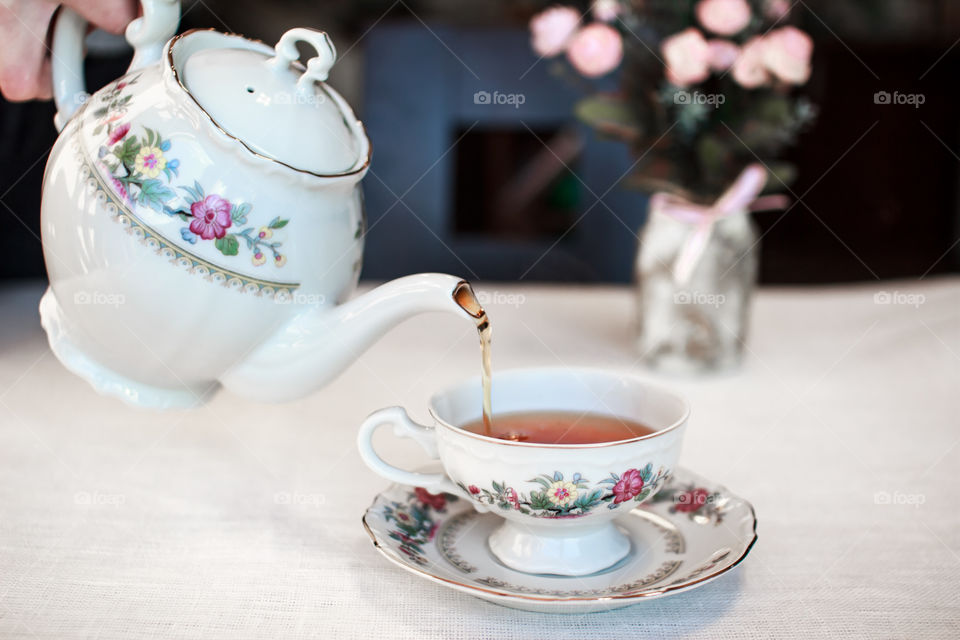 Ceramics tea pot with cup and saucer