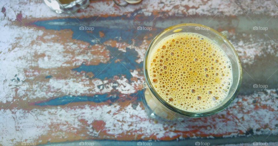 Glass of tea on table