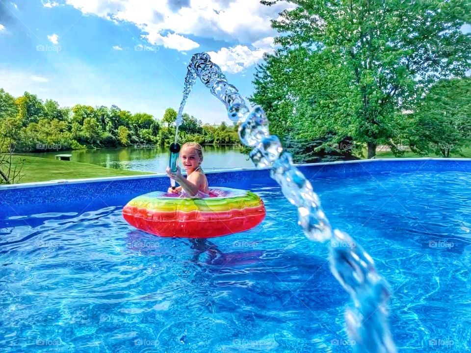 squirt gun fires at camera in pool