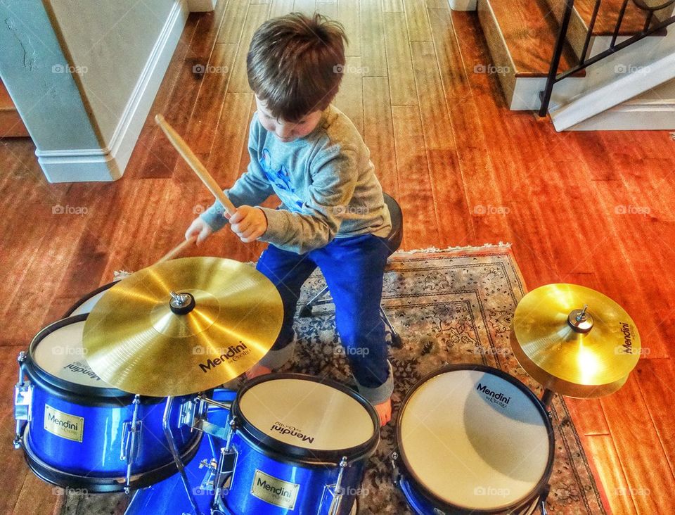 Rocking Out On The Drums. Young Boy Playing Drums
