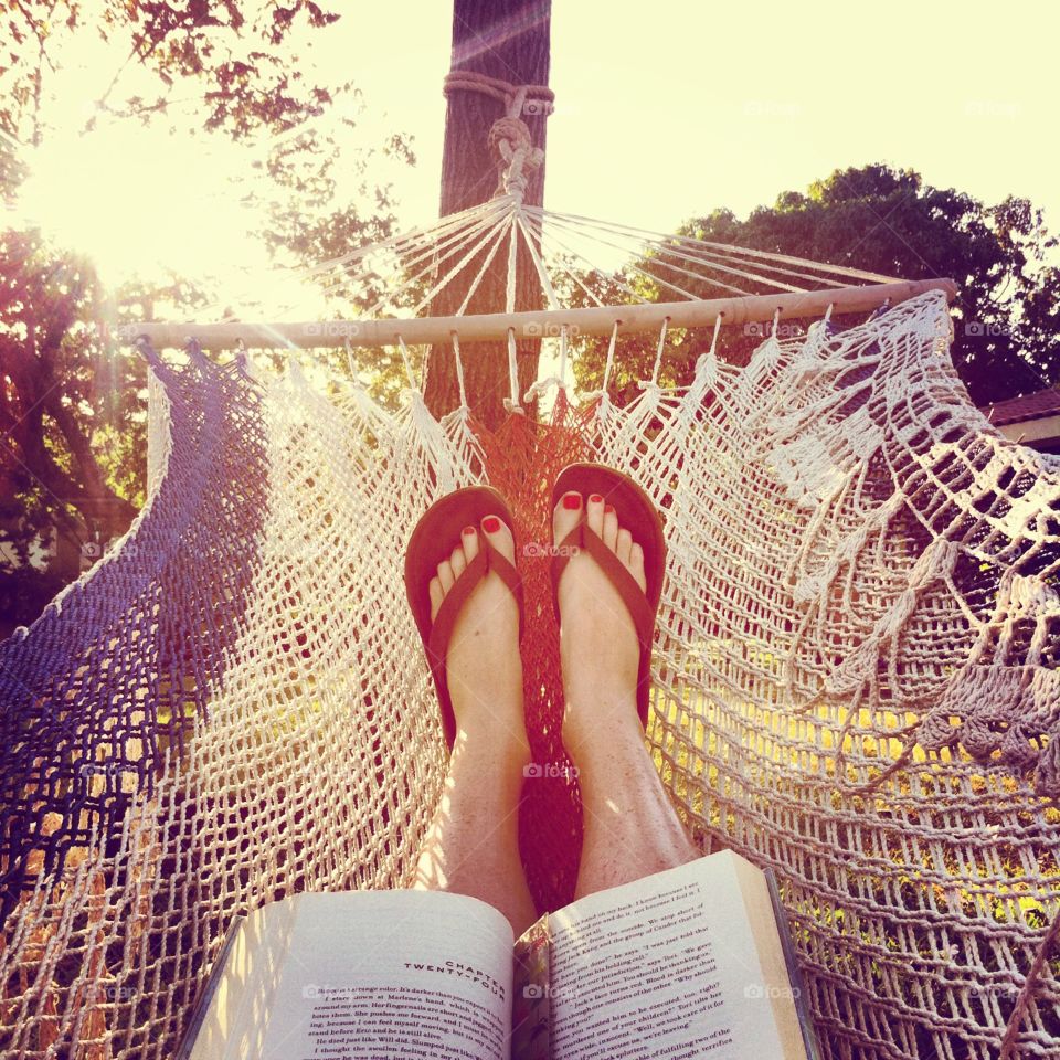 Feet up in a hammock with a book in the hands taking in the Costa Rican sunshine.