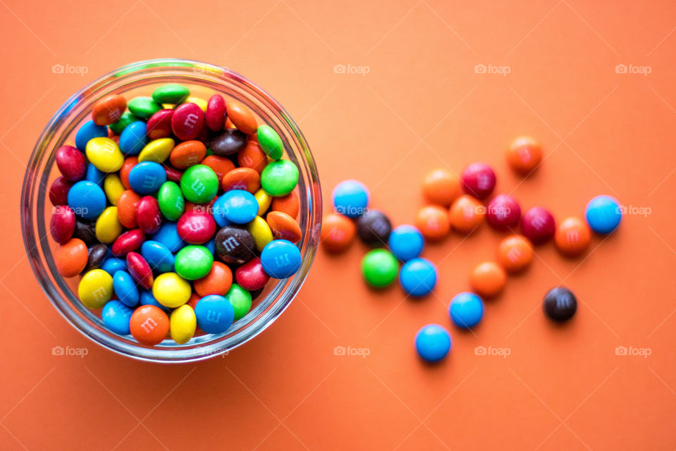 M&M's on orange background