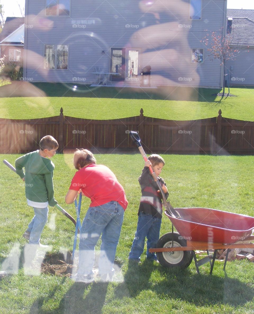 Small children working on ground