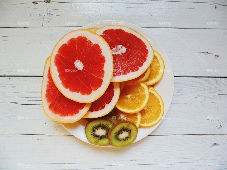 Citrus fruit slices on plate