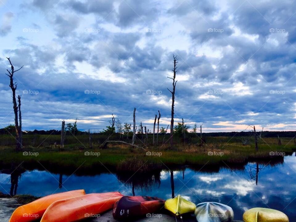 Reflection on water at kayak launch