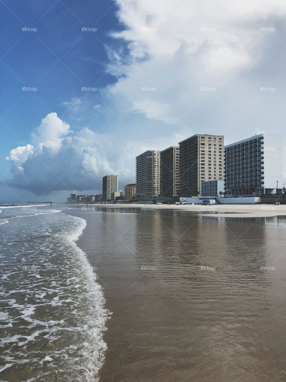 The marvelous Daytona beach in all its glory! Clear waters, blue skies, and buildings as tall and high as the eye can see. 