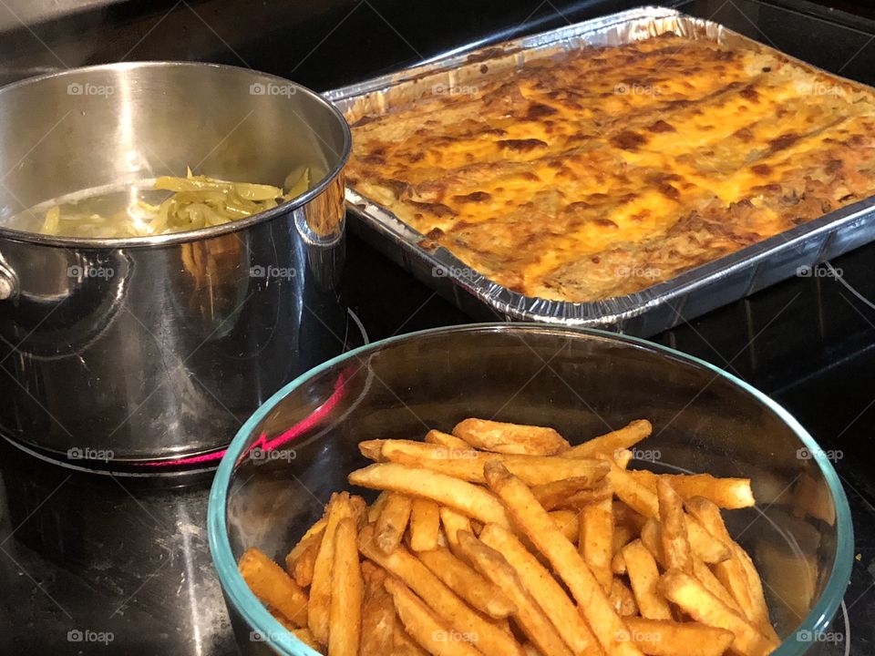 Enchiladas. French fries and green beans