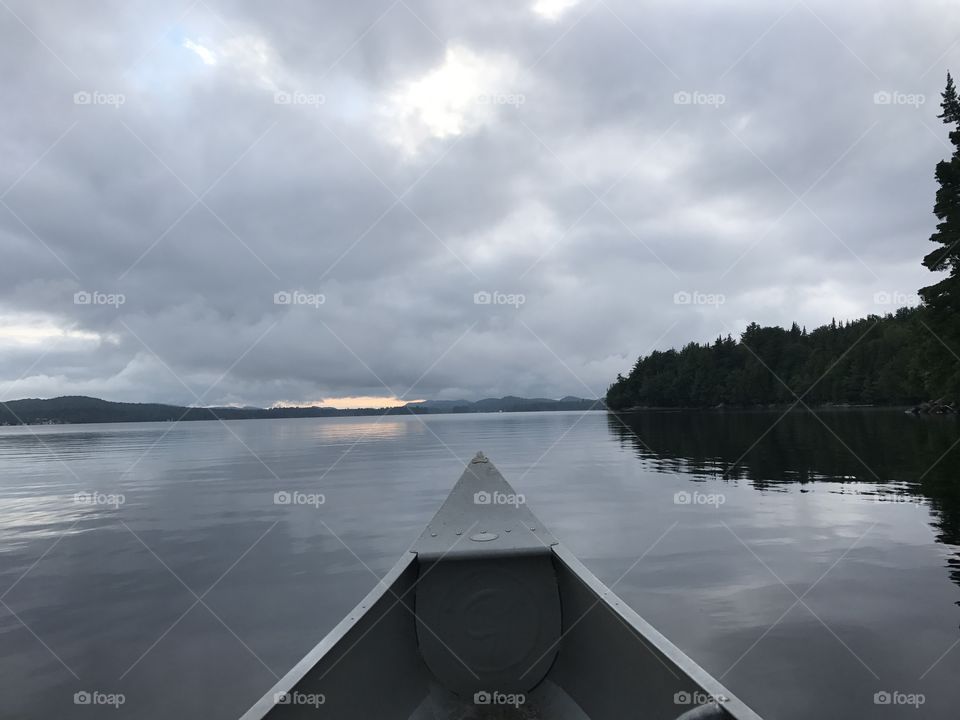 Canoe on peaceful lake.