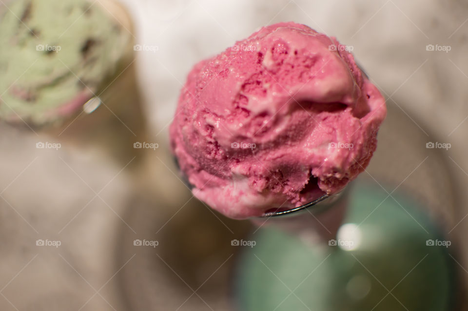 Green mint ice cream with pink ice cream high angle view with focus on pink 