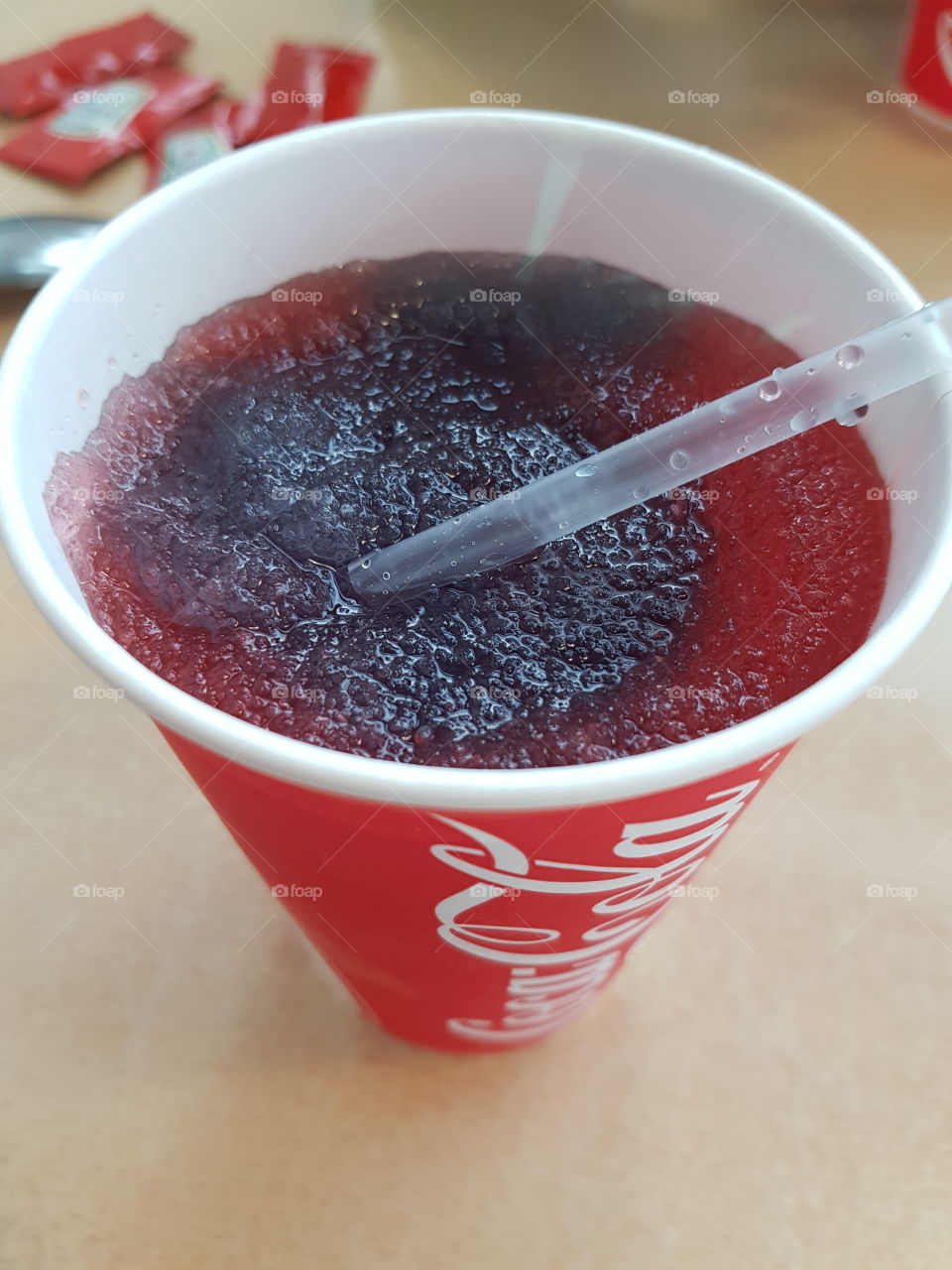 A mixture of the Blie flavoured Slushi and the Red Raspberry flavoured Slushi in a Coca Cola cup.
