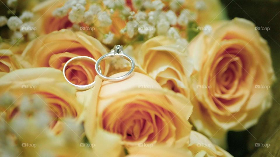 wedding ring in the middle of a rose