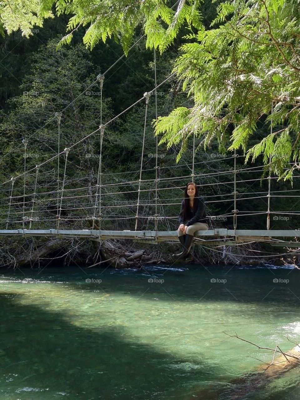 Lady on a bridge.