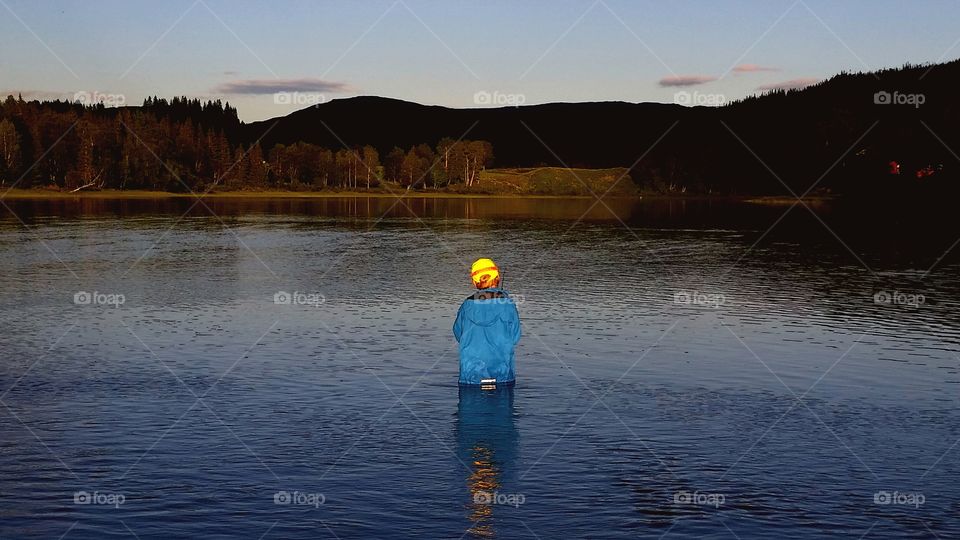 Sunset light!. My son is fishing in the light of sunset.