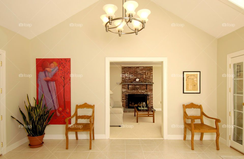 Entry way to a home with a view of the fireplace