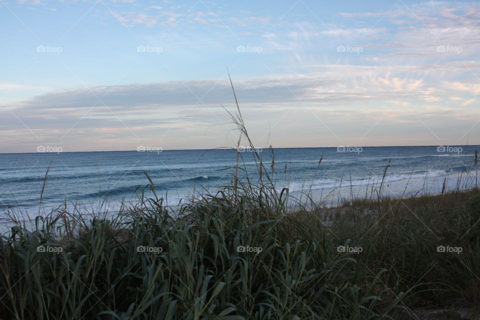 Atlantic Ocean beach. Beach view close to sunset looking over the atlantic on a partly sunny day