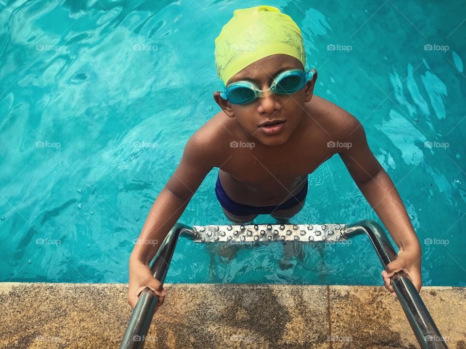 Kids from India, swimming in the pool