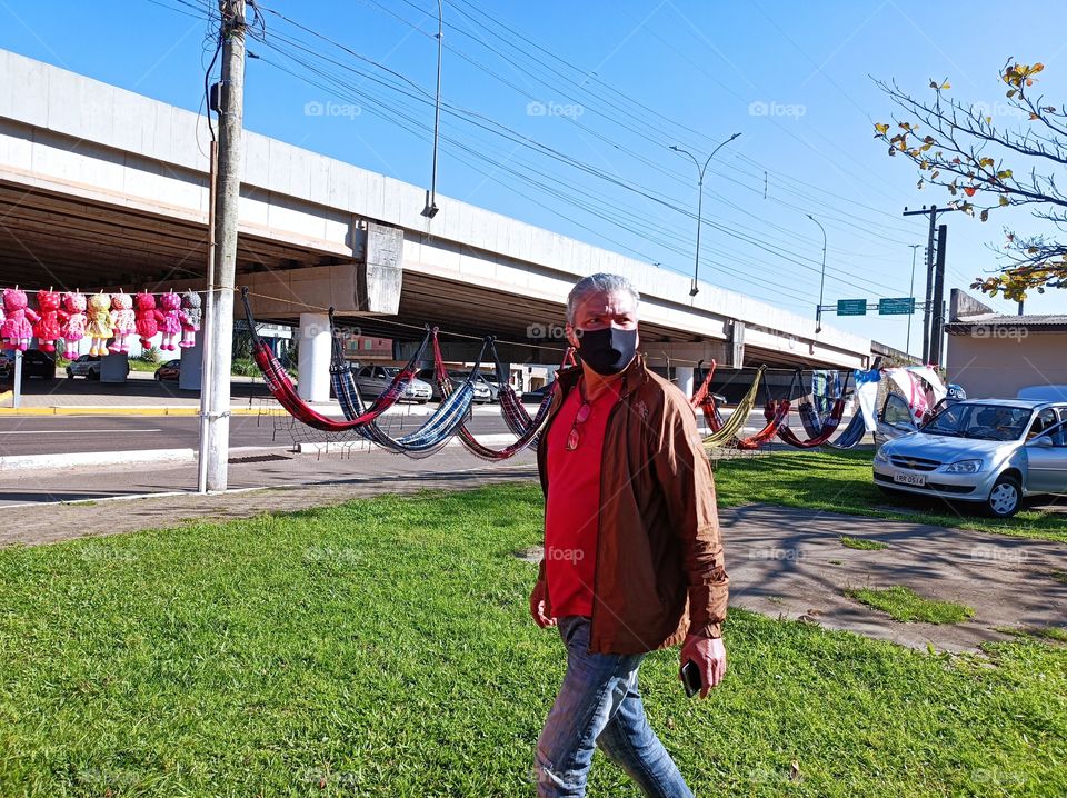Man walking to buy hammocks