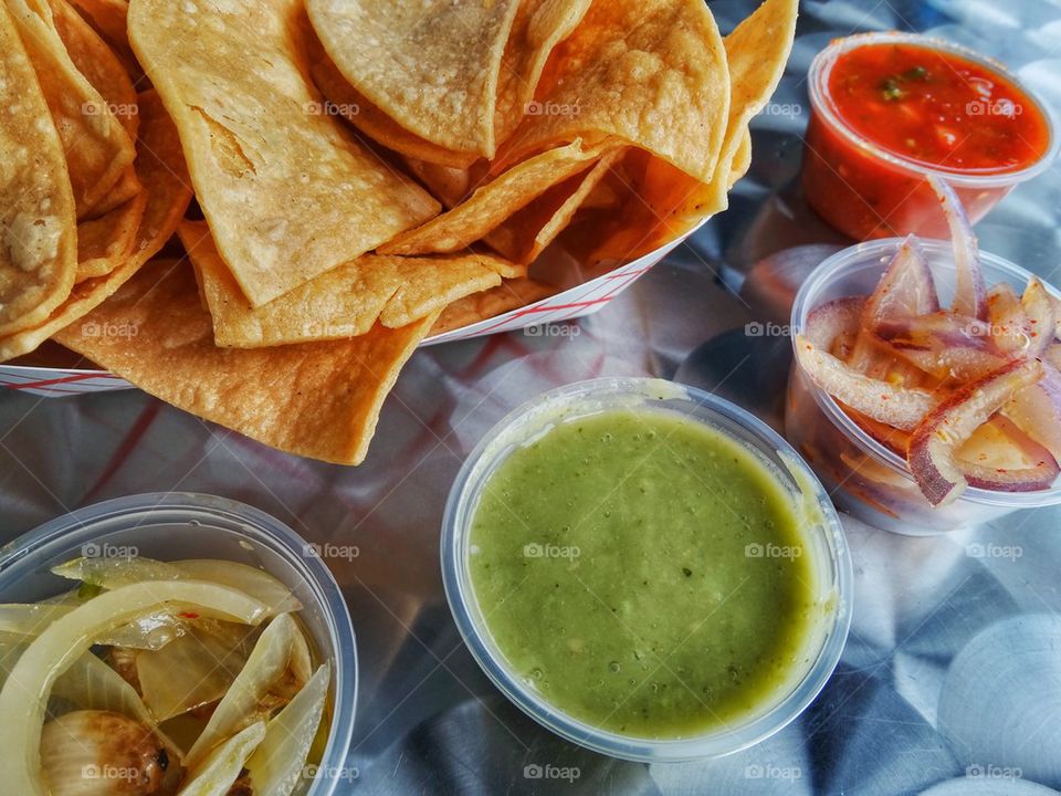 Tortilla Chips With A Colorful Selection Of Sauces. Chips And Salsa
