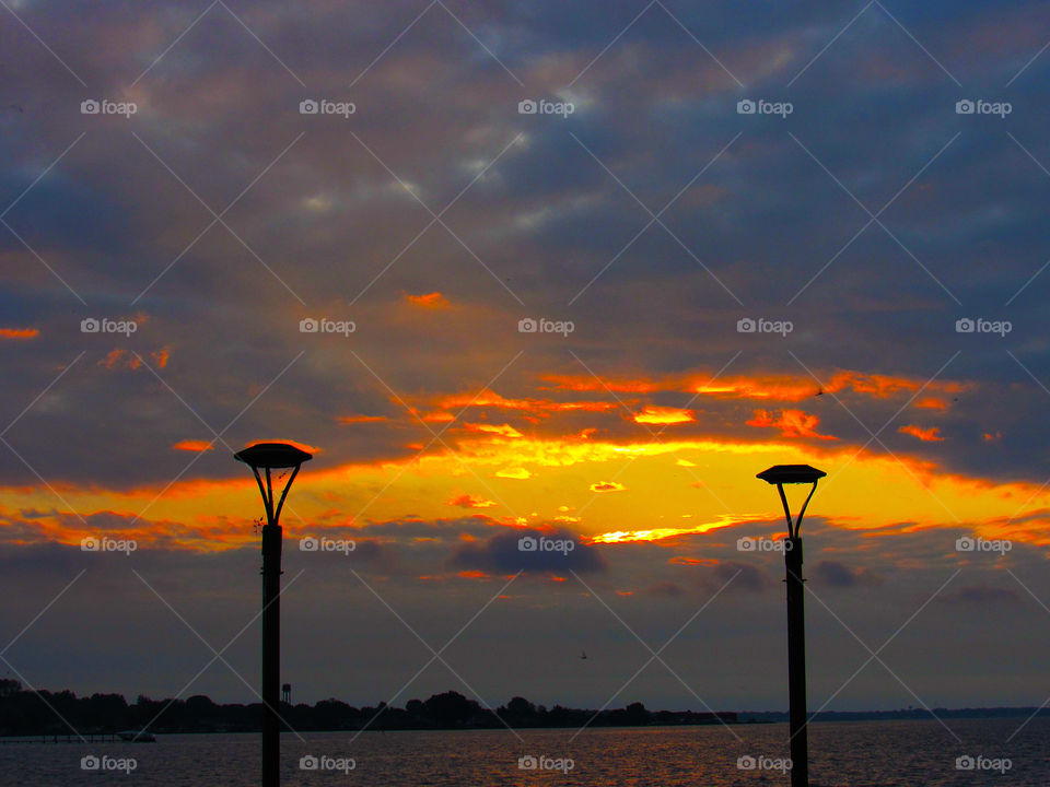 Sunrise between the lights. lampposts and sunrise at brandenburg