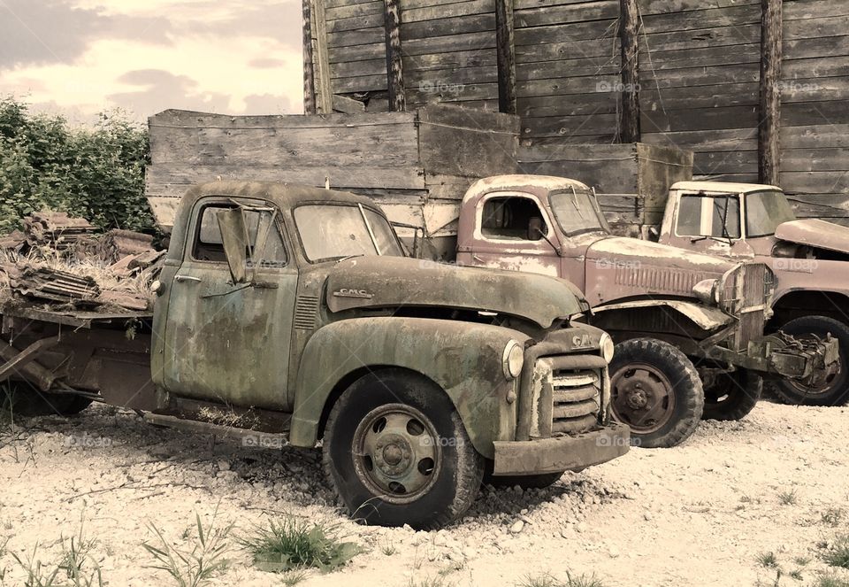 Nostalgic Farm Trucks. Faded closeup of local farm trucks.