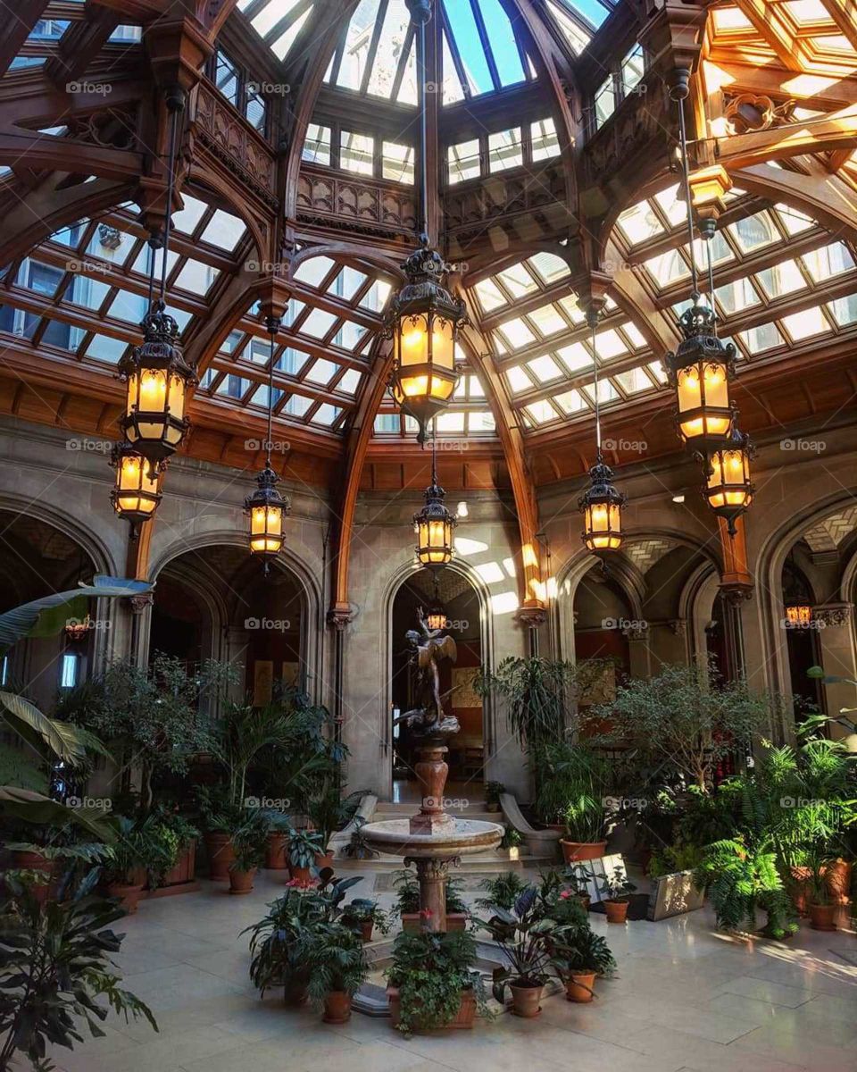 Indoor Rotunda and Garden with Sculpture and Greenery (Green Plants), Windows Covering the Ceiling/Roof, and Hanging Lanterns at the Biltmore Estate and Mansion in Asheville, North Carolina