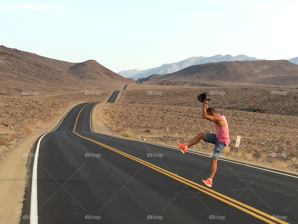 Man jumps on the cool road