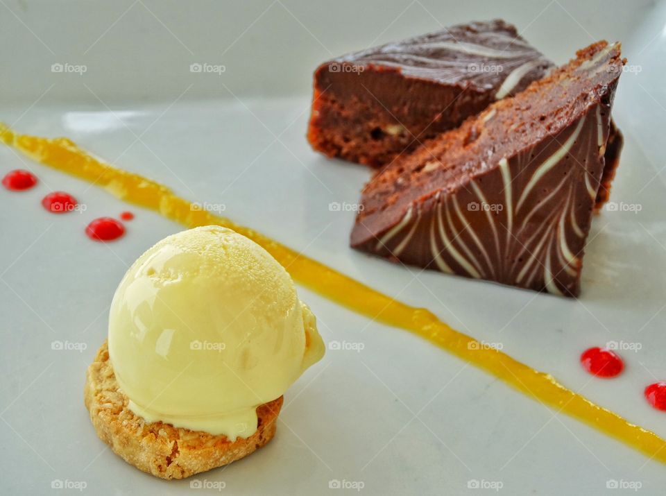 Chocolate Cake With Ice Cream. Elegant Gourmet Dessert Of Rich Chocolate Cake And Vanilla Ice Cream
