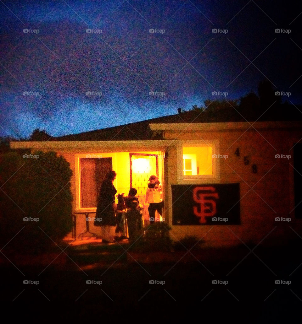 Atmospheric home and porch with neighbors visiting in the evening