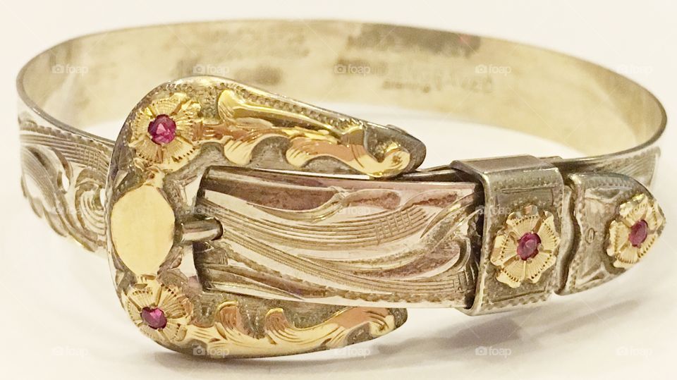 Handcrafted sterling silver and gold bracelet with rubies. 