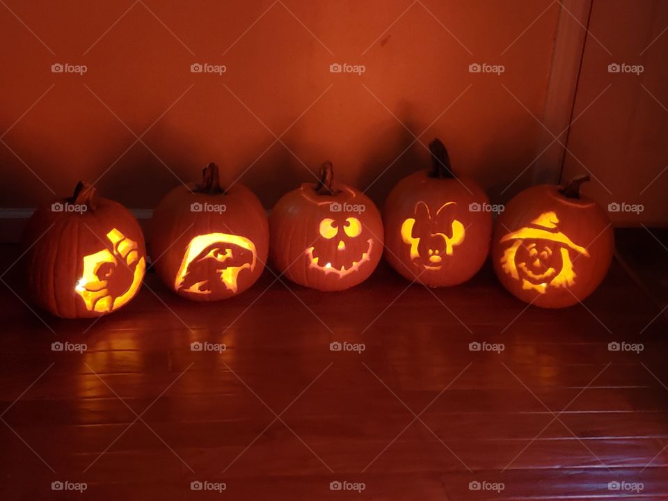 A line of carved pumpkins