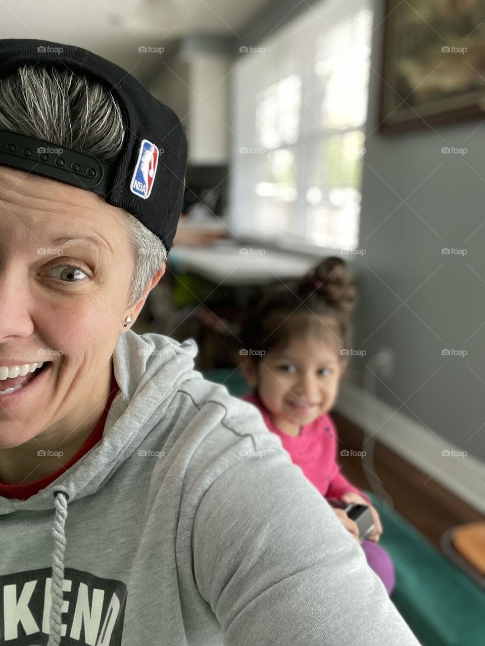 Toddler photo bombs mother’s selfie, Mother takes selfie with daughter, mommy and toddler selfie, funny toddler antics, toddler girl laughs at mother 