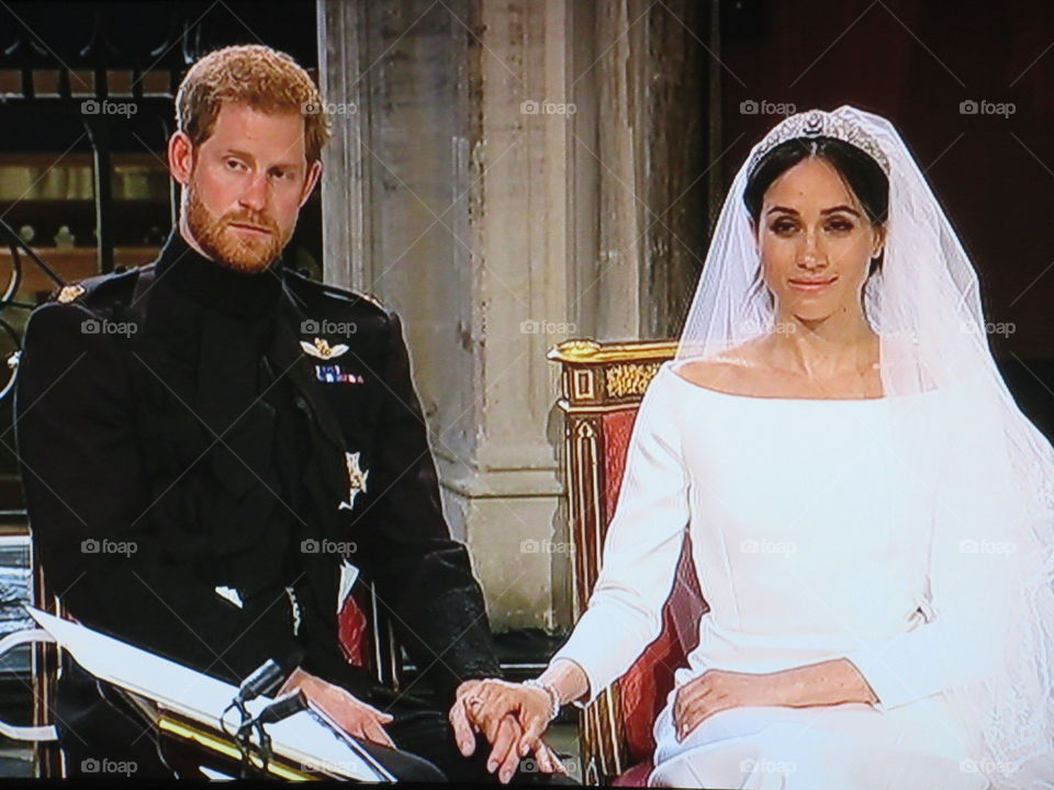 Harry and Meghan on their wedding day. (photo taken from tv screen)