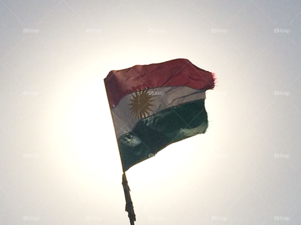 Flag in front of sunset 