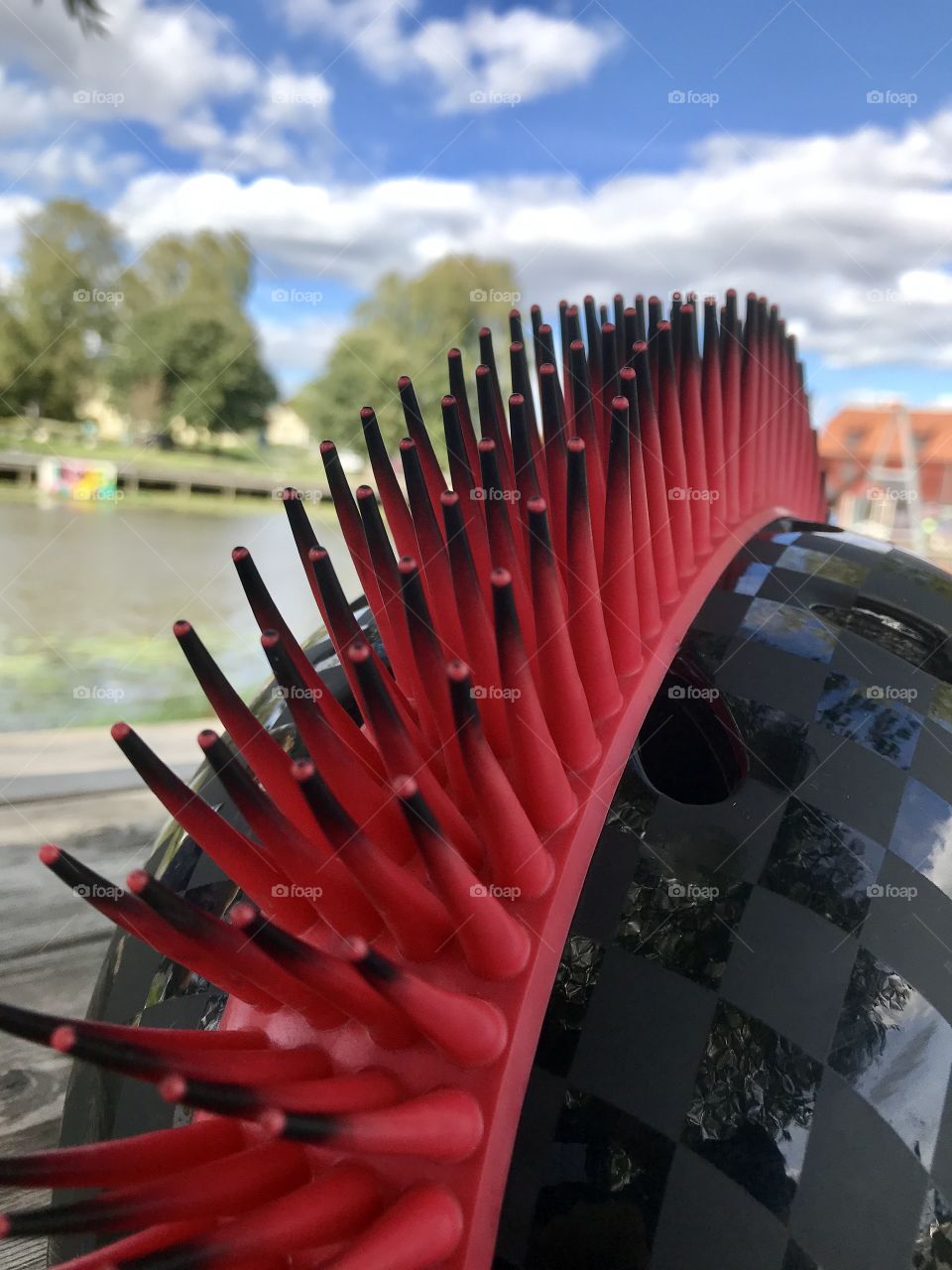 Close up of a Mohegan punk bicycle helmet on a sunny day outdoors. 