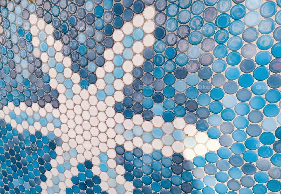 Close up of a star in a mosaic with round mosaic tiles