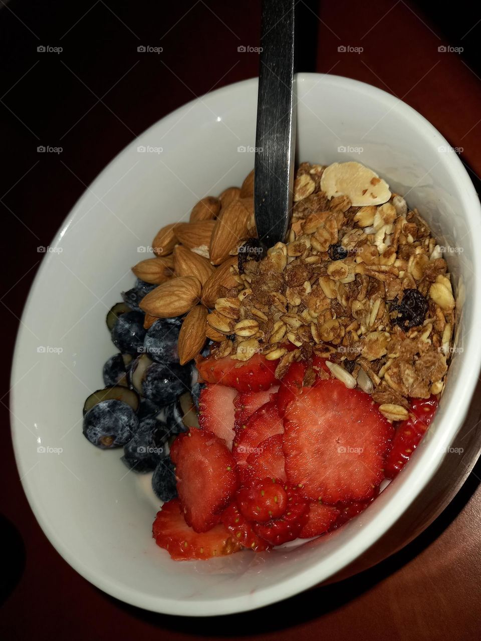 Breakfast euphoria - yoghurt, muesli, almonds, blueberries and strawberries