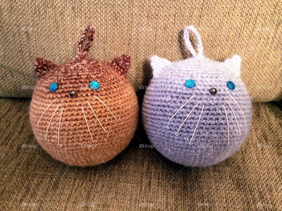 Two handmade crocheted decorative persian cat toys with hanging eyelets