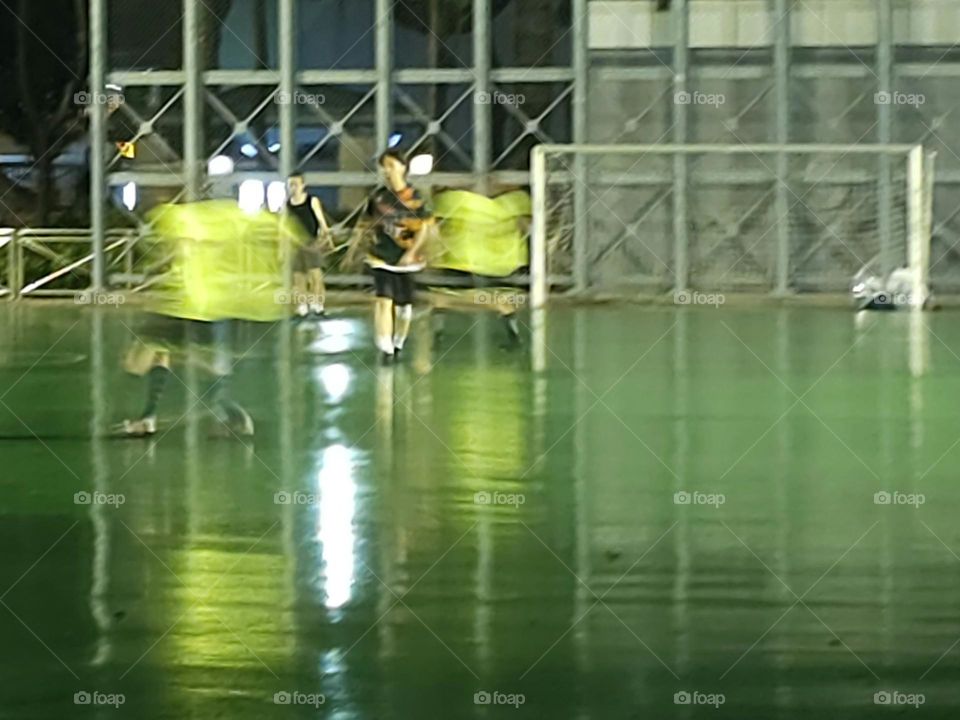 Soccer at night in the rain