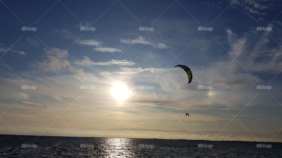 sunset kite surfing