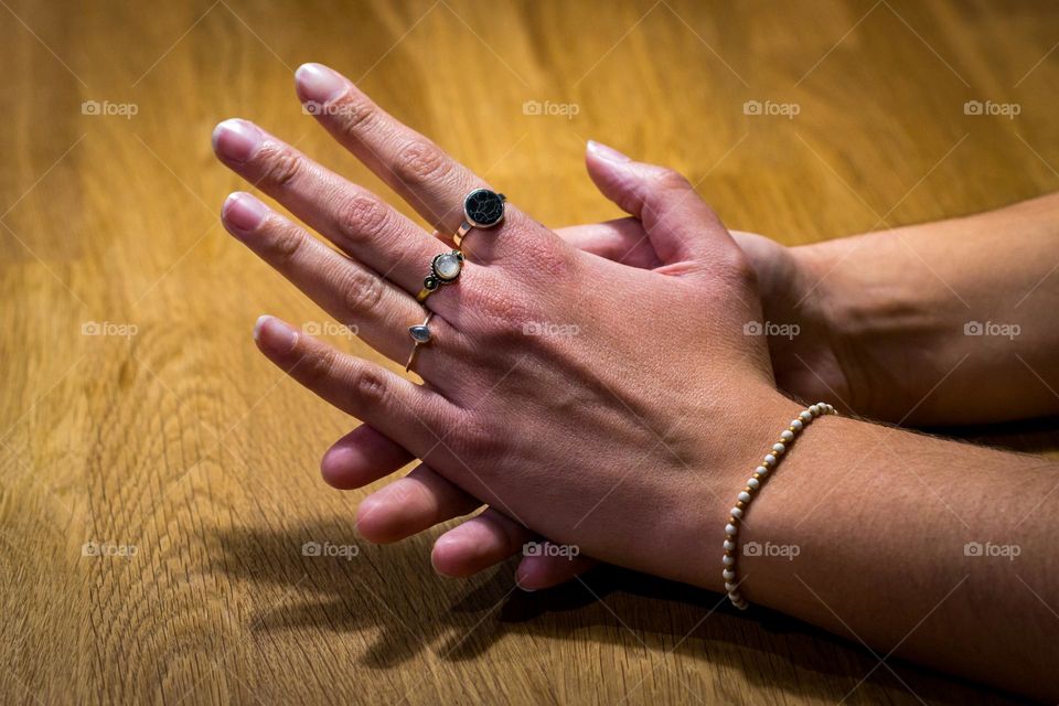Rings and bracelet in a woman hand