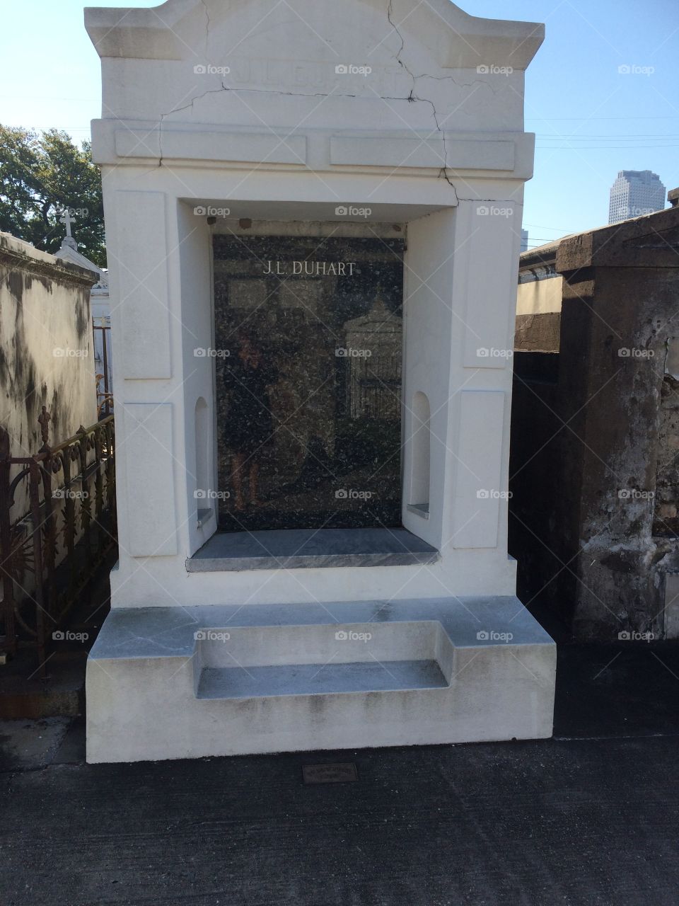 St. Louis cemetery in New Orleans. My reflection shows up on the tomb but I didn't see it when I took the picture.  It was a beautiful building so I didn't want to exclude it.