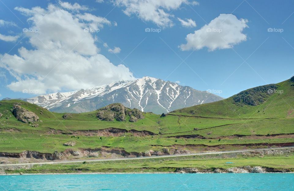Snowy mountain on spring