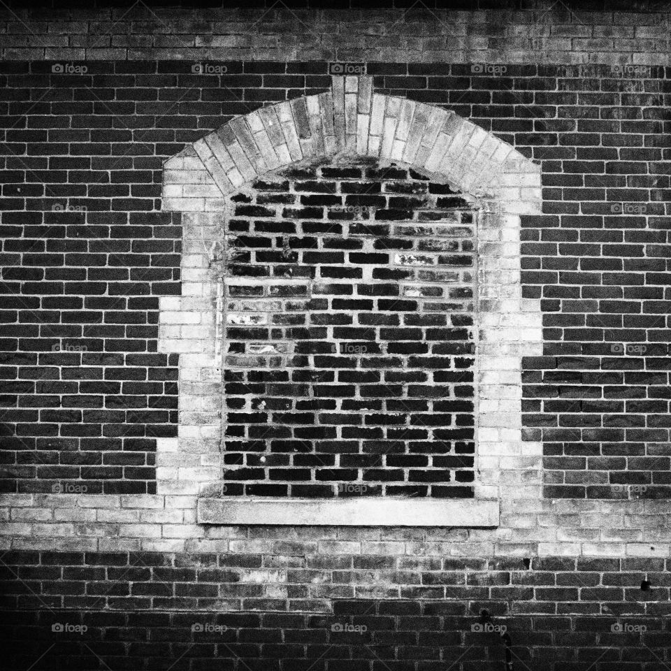 Brick and mortar windowless wall